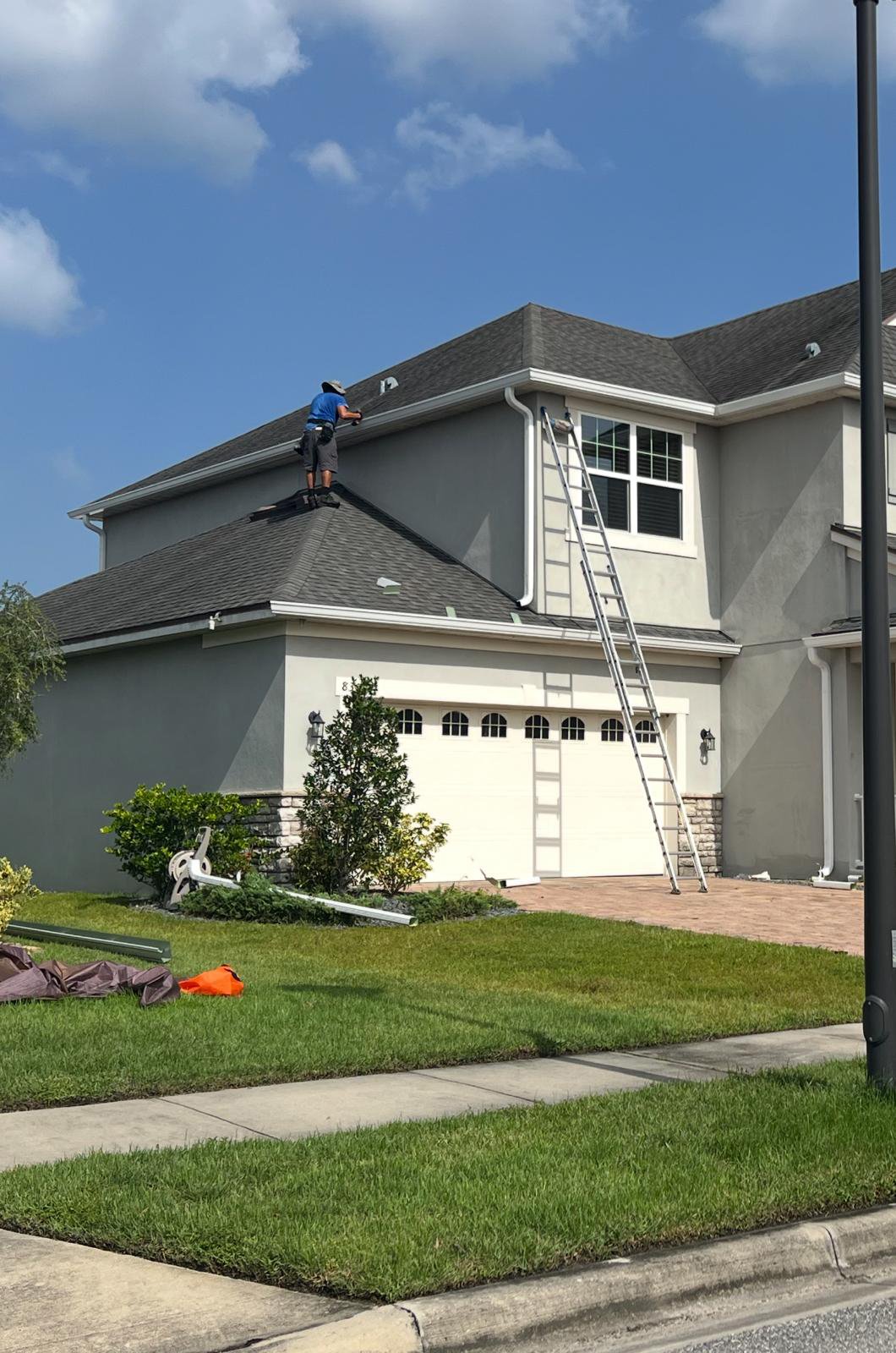 Gutters being installed on an American house